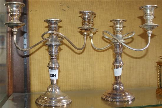 A pair of modern? plated two branch candelabra